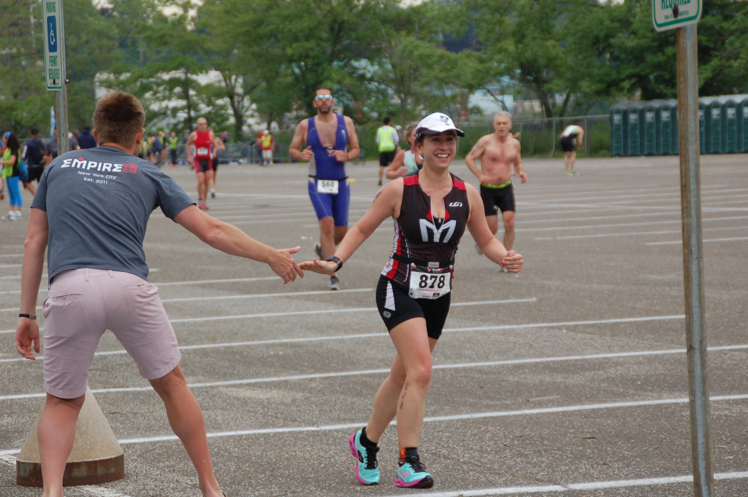 A woman holding her hand out to another person.